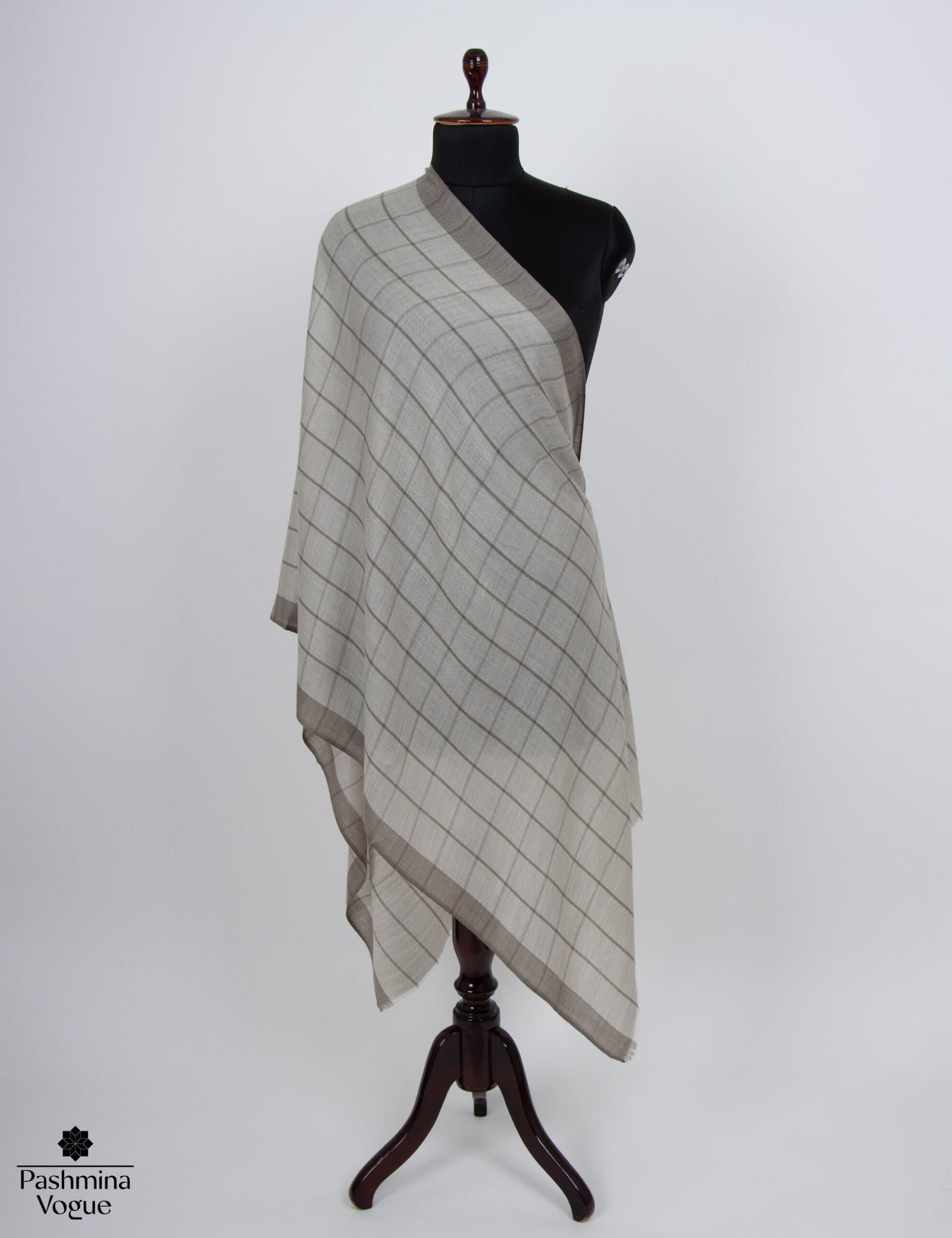 soft Merino wool wrap with a classic checked pattern, highlighting its cozy texture and elegant style, perfect as a luxury gift for her.