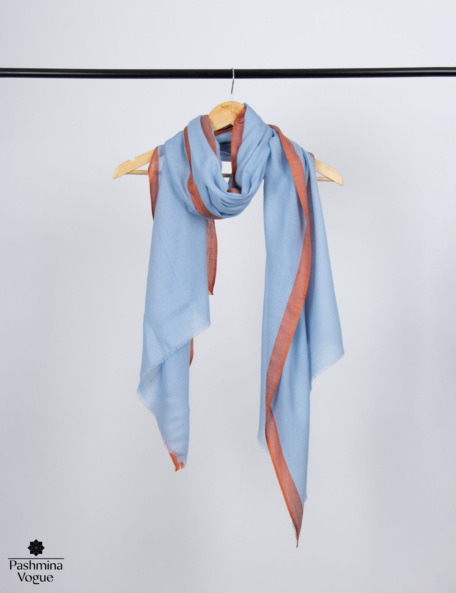 fine silk and wool blend two-tone shawl, showing the soft, reversible sides in vibrant blue and complementary orange.