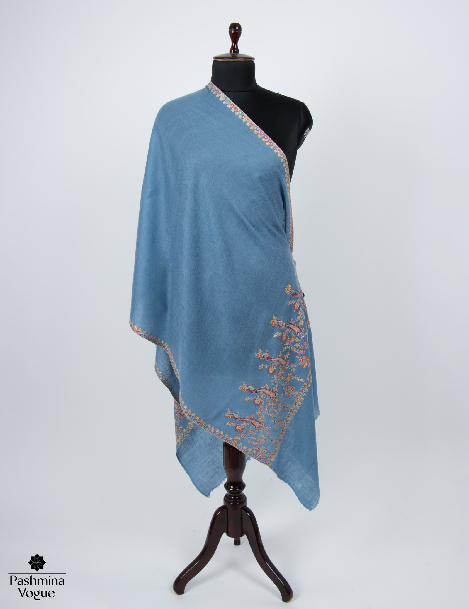 blue pure pashmina shawl featuring long, intricate bands of Sozni hand-embroidery along the vertical borders (Palladar), highlighting the fine detail and luxurious cashmere texture.
