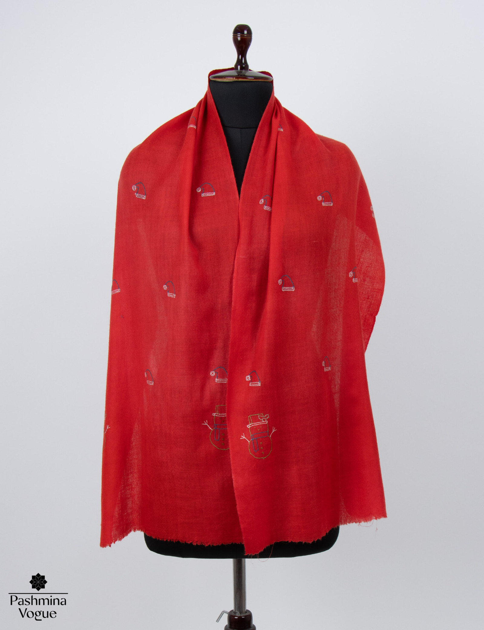 A festive ivory pashmina scarf with hand-embroidered snowman motifs, showcasing the soft cashmere texture and intricate holiday needlework.