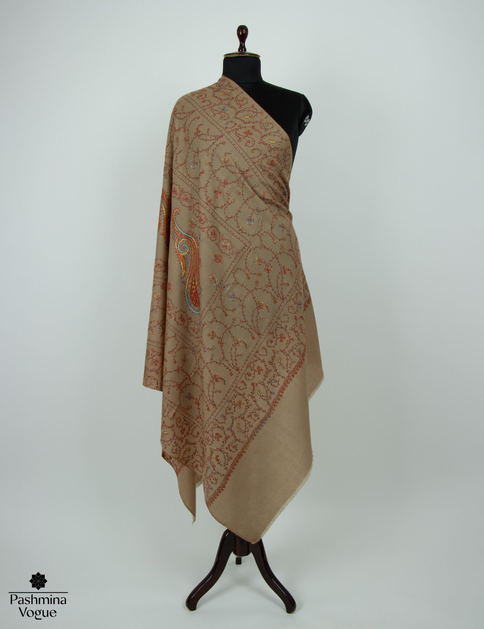 hand-embroidered Kashmiri wool shawl showing detailed Sozni needlework and the soft, rich texture of the fine wool fabric.