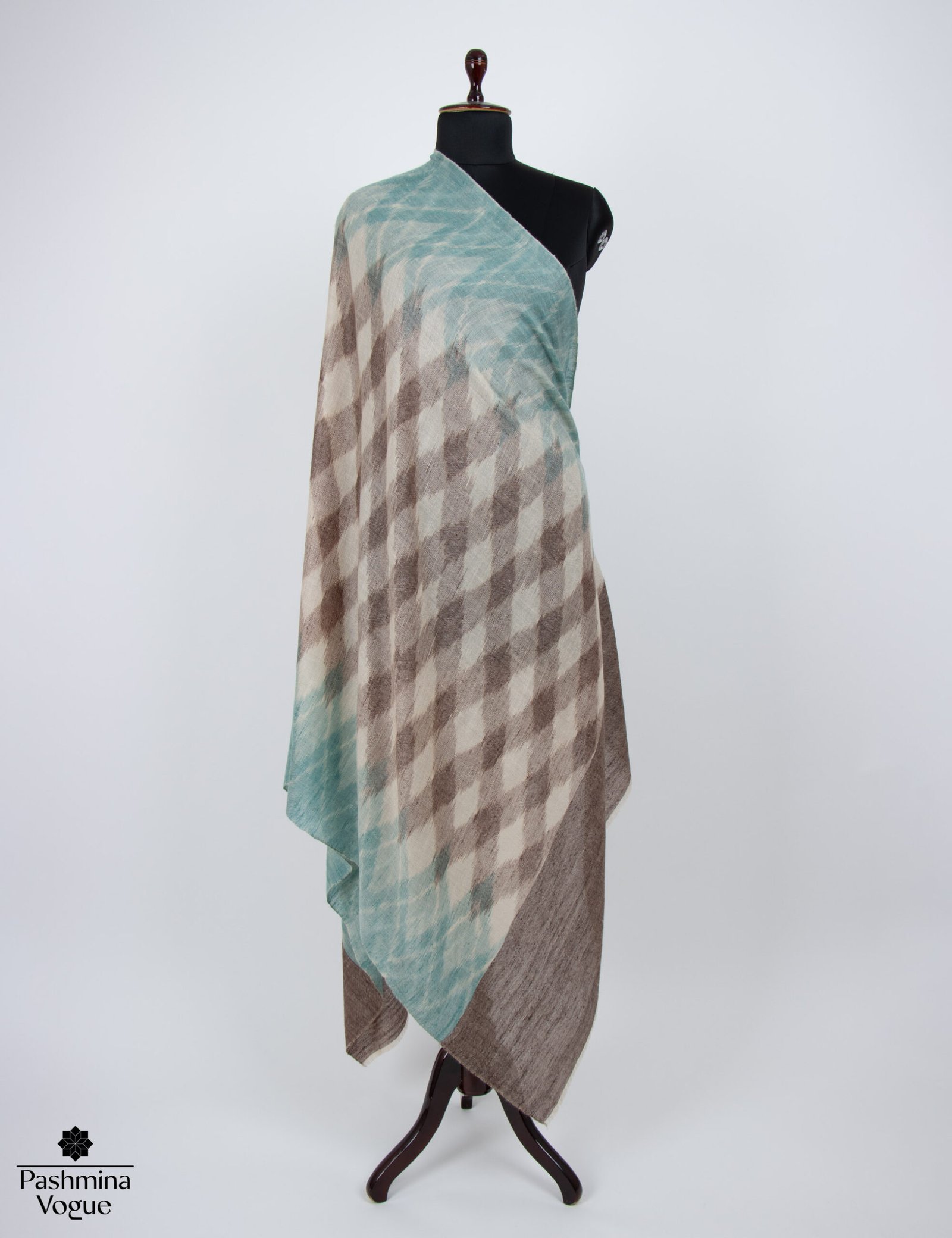 handwoven Ikat Pashmina shawl in a sophisticated grey and white pattern, showcasing the soft cashmere texture and unique tie-dyed weave.