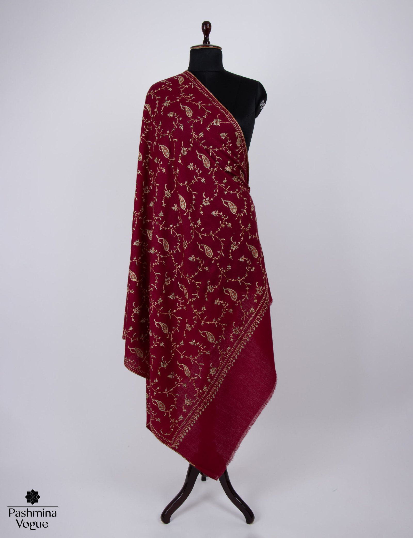 burgundy wool stole with intricate Kashmiri hand-embroidery on the borders, draped elegantly to show the fine texture and deep red-wine color.