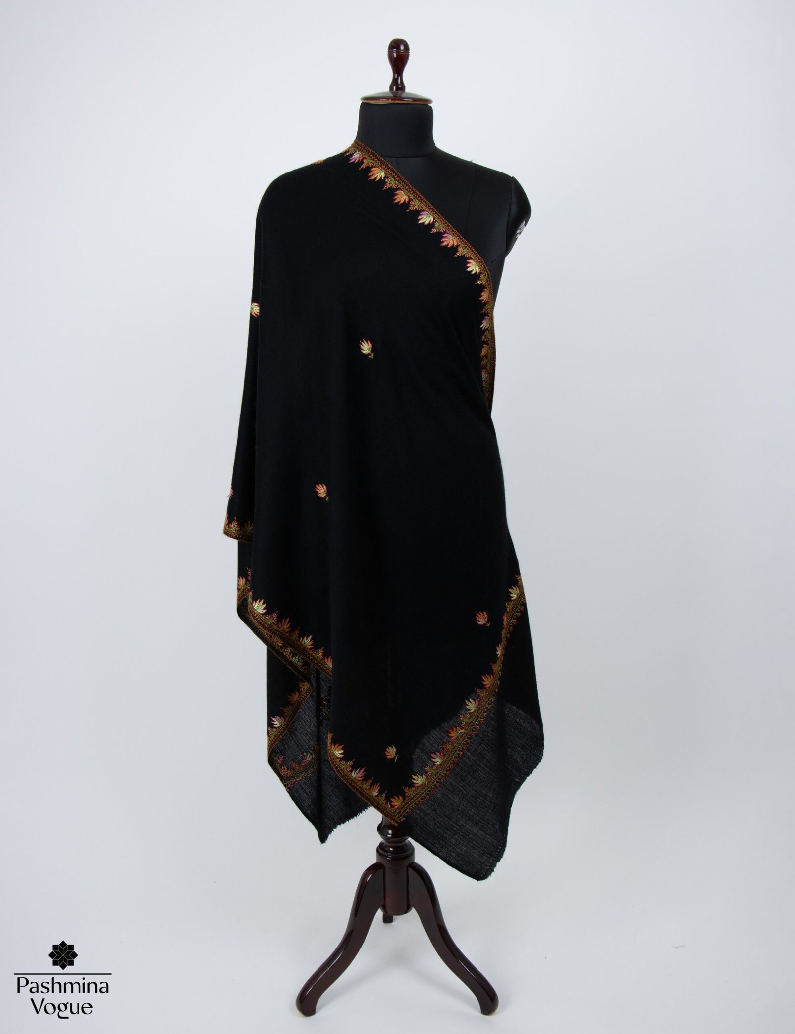 A draped black cashmere scarf with a baby-soft texture, highlighting its luxurious and elegant look.