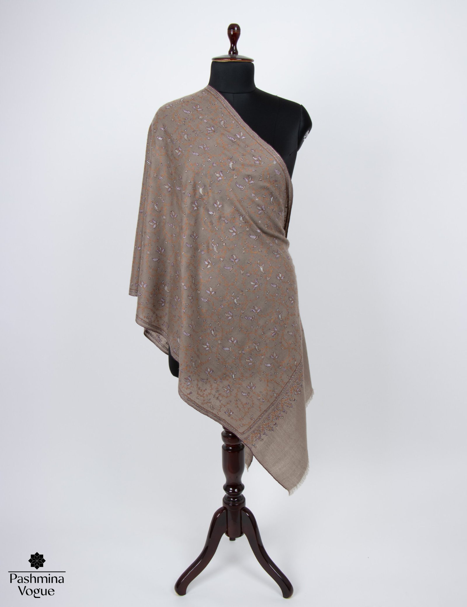 brown pashmina scarf with an intricate Paisley pattern, highlighting its handmade quality and soft cashmere texture, ideal for winter.