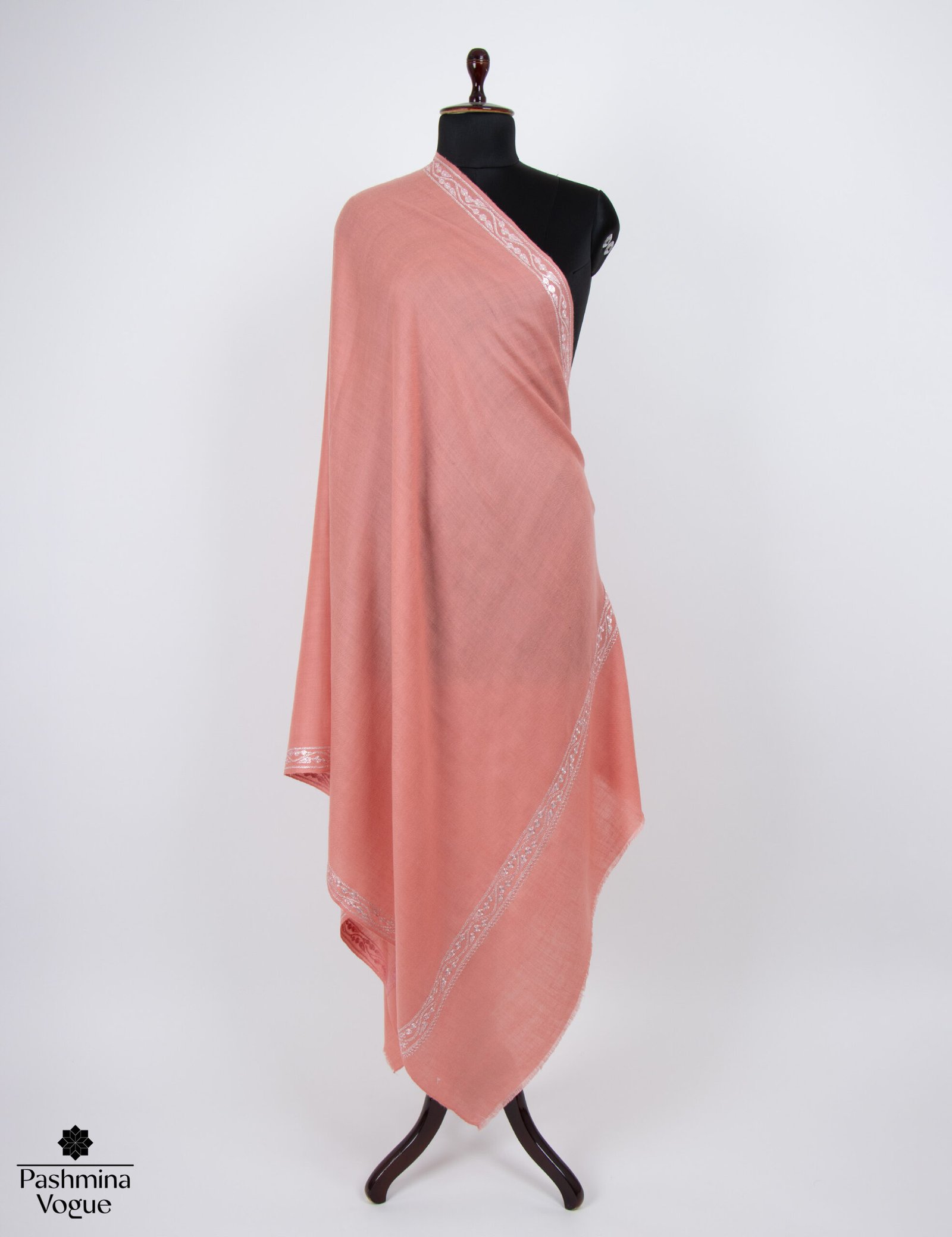 soft peach pure pashmina shawl on a mannequin, showcasing the shimmering hand-embroidered tilla (metallic thread) geometric border and soft cashmere texture.
