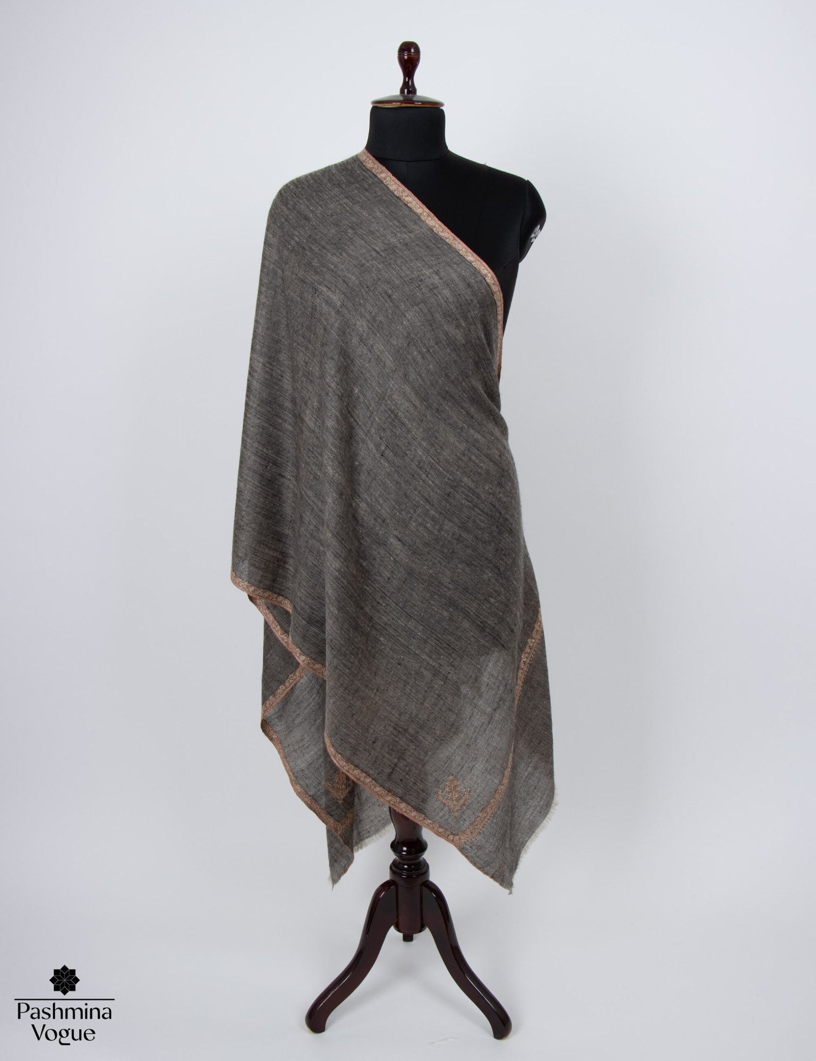 A draped classic black pure pashmina shawl with fine Kashmiri Sozni hand embroidery, highlighting the soft cashmere texture and intricate detailing.