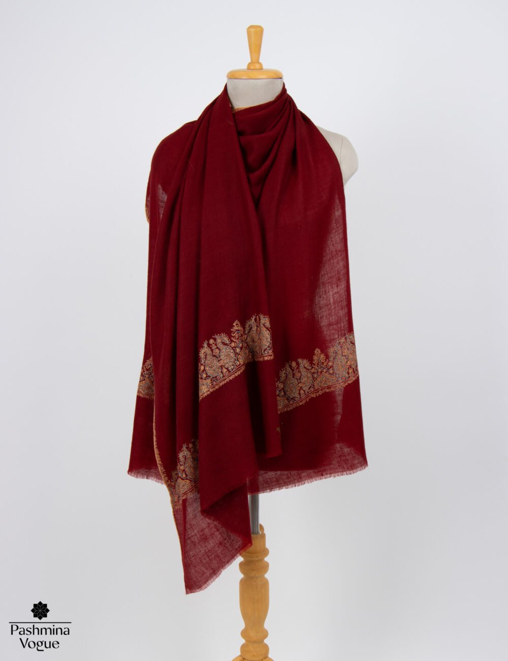 Luxury ivory handmade Sozni embroidered Pashmina shawl styled as an elegant bridal wedding wrap by Pashmina Vogue.
