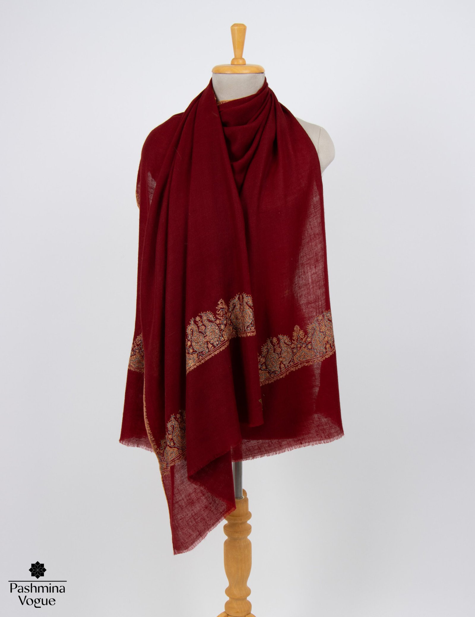 Luxury ivory handmade Sozni embroidered Pashmina shawl styled as an elegant bridal wedding wrap by Pashmina Vogue.