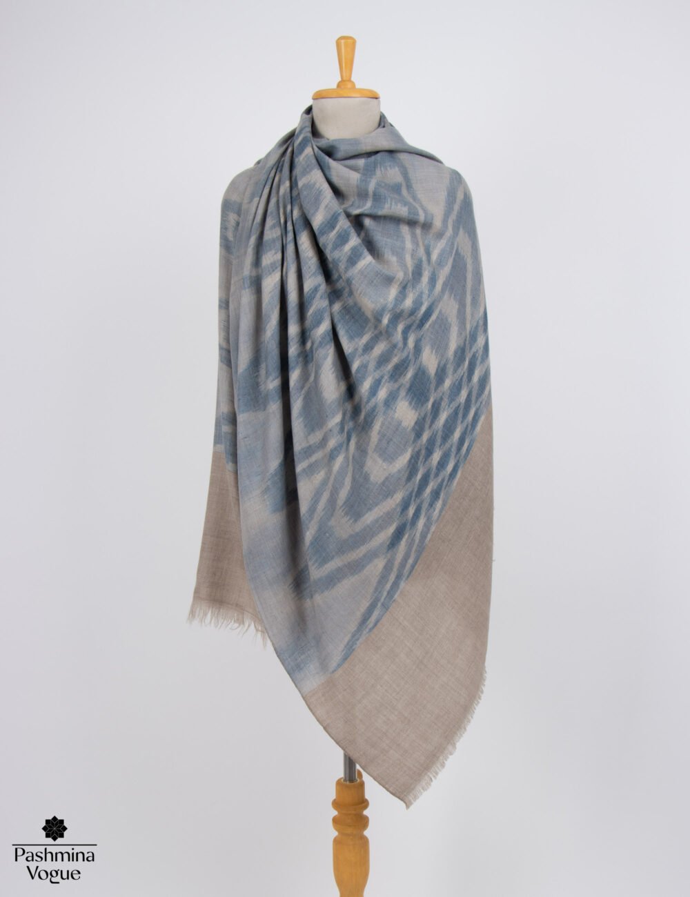 Luxury handwoven Ikat Pashmina scarf showcasing sharp modern geometric resist-dye patterns by Pashmina Vogue.
