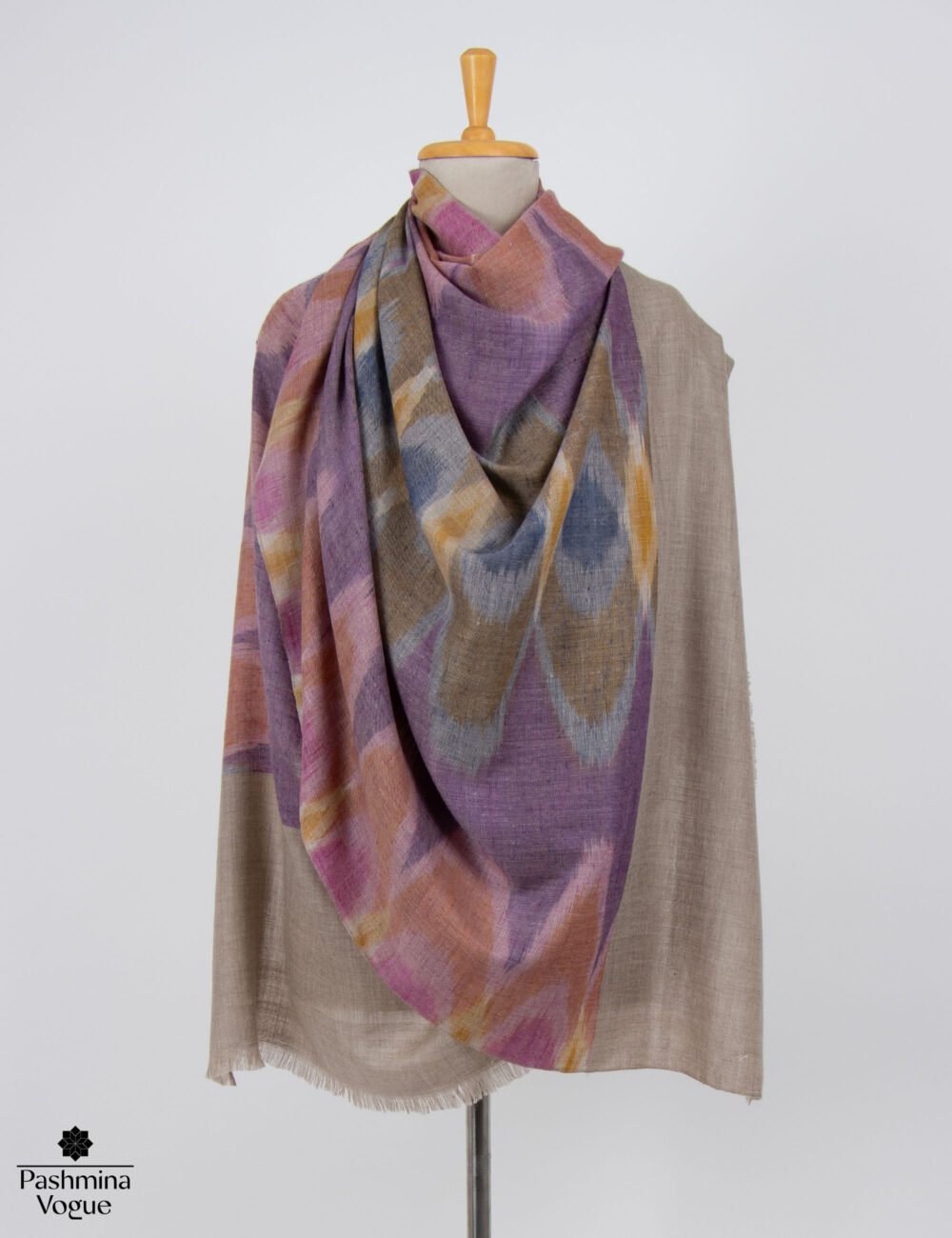 Ikat Pashmina shawl displayed as a pure Pashmina handwoven scarf from Kashmir with geometric patterns.